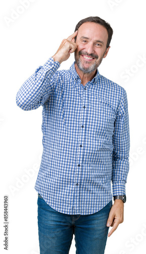 Handsome middle age elegant senior man over isolated background Smiling pointing to head with one finger, great idea or thought, good memory