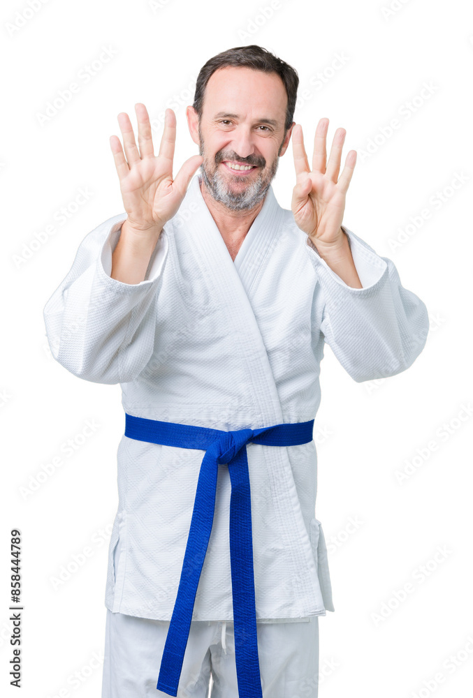 Handsome middle age senior man wearing kimono uniform over isolated background showing and pointing up with fingers number nine while smiling confident and happy. Handsome middle age senior man wearing kimono uniform over isolated background showing and pointing up with fingers number nine while smiling confident and happy.
