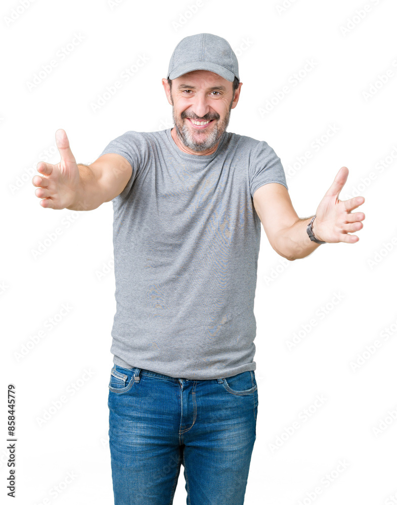 Handsome middle age hoary senior man wearing sport cap over isolated background looking at the camera smiling with open arms for hug. Cheerful expression embracing happiness. Handsome middle age hoary senior man wearing sport cap over isolated background looking at the camera smiling with open arms for hug. Cheerful expression embracing happiness.