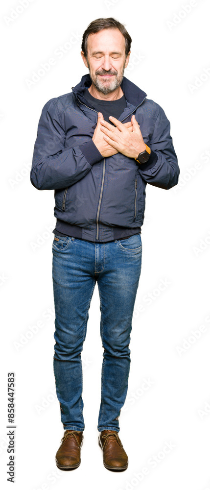 Middle age handsome man wearing a jacket smiling with hands on chest with closed eyes and grateful gesture on face. Health concept. Middle age handsome man wearing a jacket smiling with hands on chest with closed eyes and grateful gesture on face. Health concept.