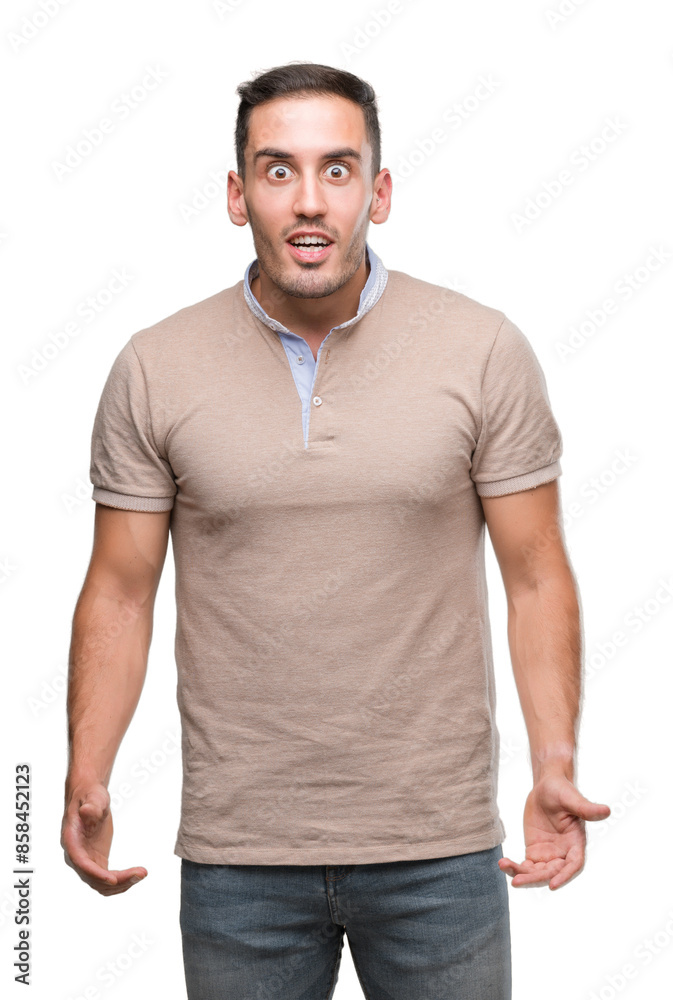 Fototapeta premium Handsome young man scared in shock with a surprise face, afraid and excited with fear expression