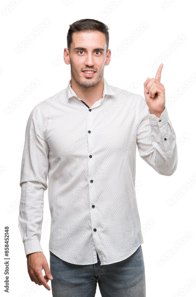 Handsome young business man surprised with an idea or question pointing finger with happy face, number one Handsome young business man surprised with an idea or question pointing finger with happy face, number one