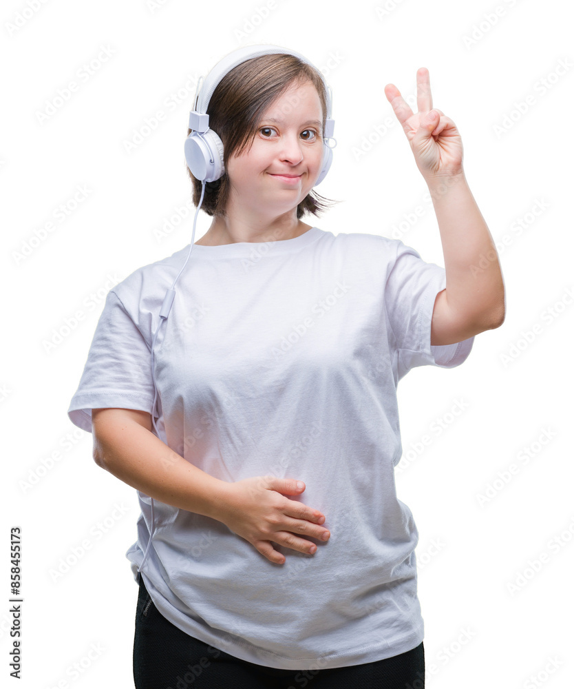 Young adult woman with down syndrome wearing headphones over isolated background smiling with happy face winking at the camera doing victory sign. Number two. Young adult woman with down syndrome wearing headphones over isolated background smiling with happy face winking at the camera doing victory sign. Number two.