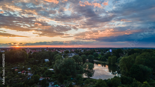 zachód słońca nad miasteczkiem, widok na rzekę  photo