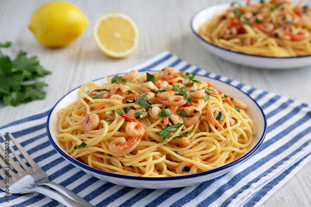 Homemade Garlic Shrimp Scampi with Parsley on a Plate, low angle view. Homemade Garlic Shrimp Scampi with Parsley on a Plate, low angle view.