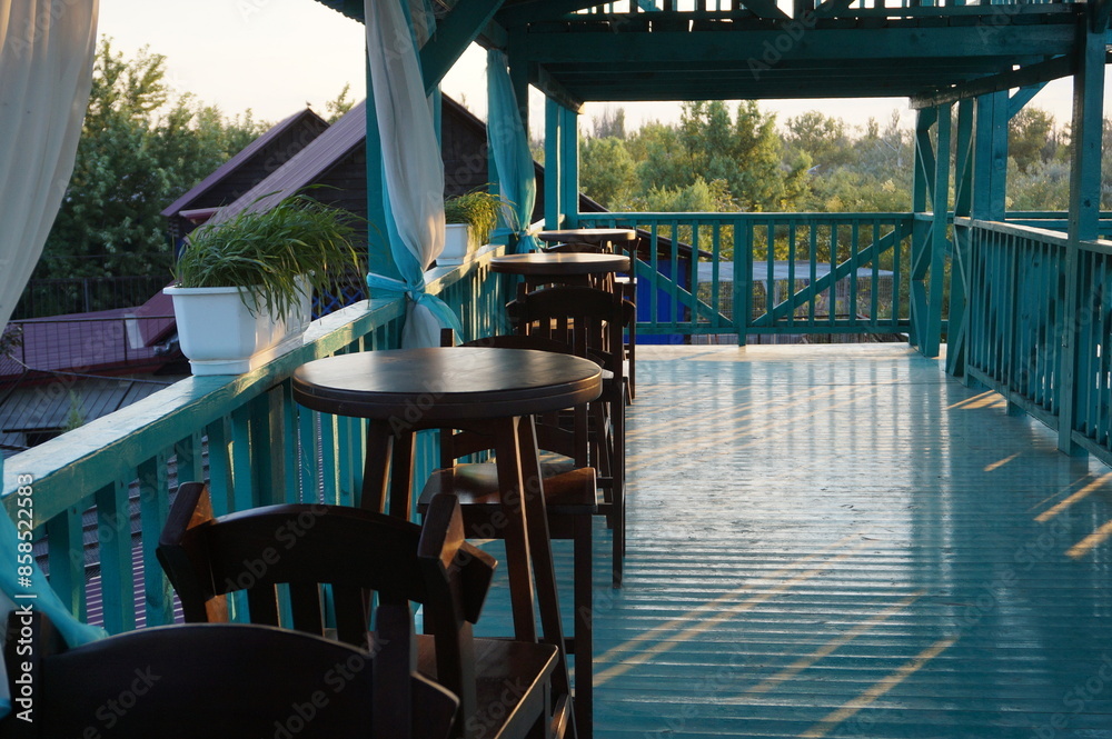 Fototapeta premium Interior of a summer cafe and brown round tables