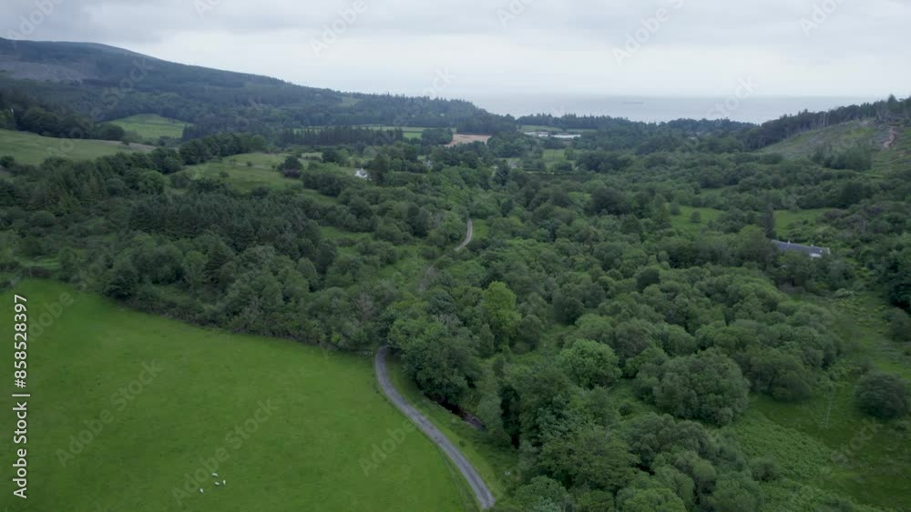 Aerial drone shot reveal of countryside house, flying over mountain shot, on the Isle Of Arran, Scotland Aerial drone shot reveal of countryside house, flying over mountain shot, on the Isle Of Arran, Scotland