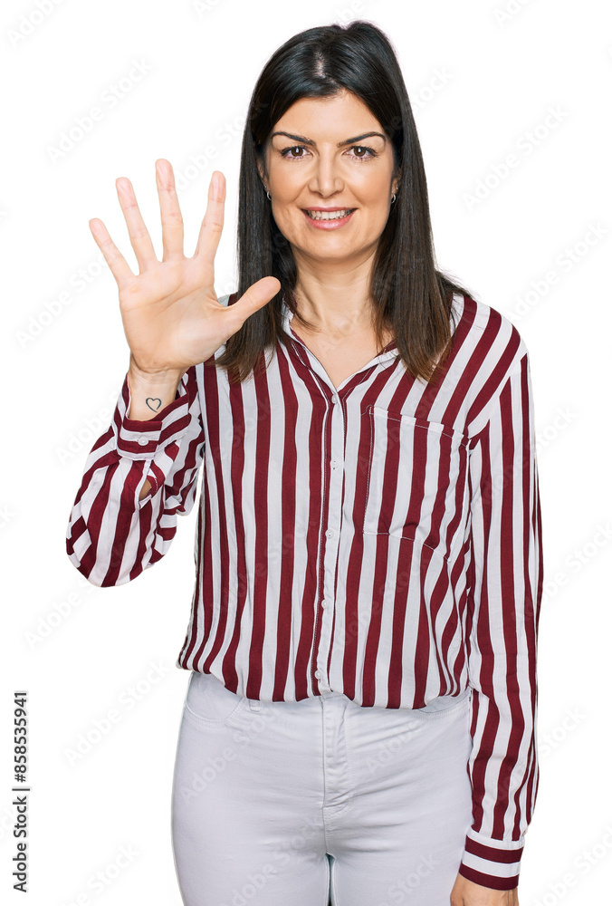 Beautiful brunette woman wearing striped shirt showing and pointing up with fingers number five while smiling confident and happy. Beautiful brunette woman wearing striped shirt showing and pointing up with fingers number five while smiling confident and happy.