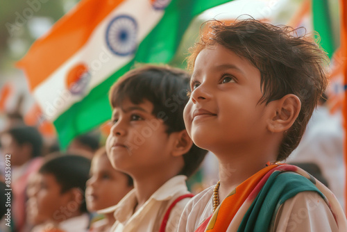 Kid watching republic day parade along with Indian Flag photo