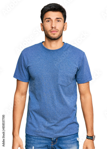 Young handsome man wearing casual clothes with serious expression on face. simple and natural looking at the camera. © Krakenimages.com