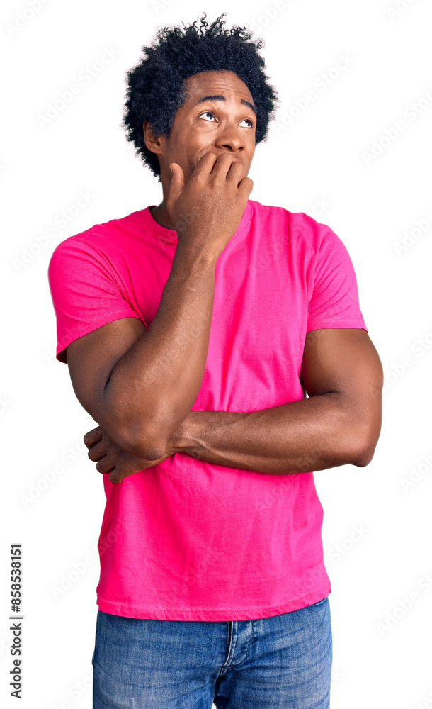Handsome african american man with afro hair wearing casual pink tshirt looking stressed and nervous with hands on mouth biting nails. anxiety problem. Handsome african american man with afro hair wearing casual pink tshirt looking stressed and nervous with hands on mouth biting nails. anxiety problem.