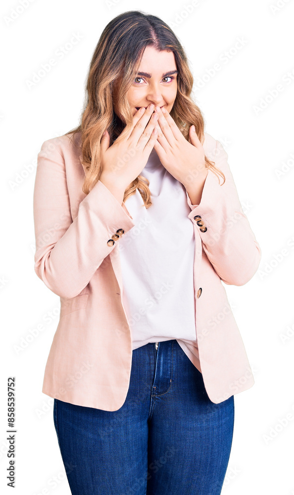 Young caucasian woman wearing business clothes laughing and embarrassed giggle covering mouth with hands, gossip and scandal concept Young caucasian woman wearing business clothes laughing and embarrassed giggle covering mouth with hands, gossip and scandal concept