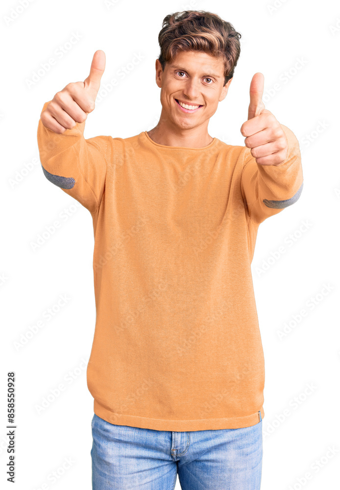 Young handsome man wearing casual clothes approving doing positive gesture with hand, thumbs up smiling and happy for success. winner gesture. Young handsome man wearing casual clothes approving doing positive gesture with hand, thumbs up smiling and happy for success. winner gesture.