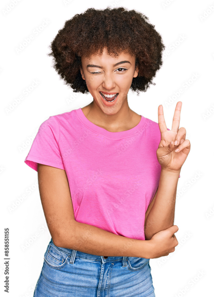 Young hispanic girl wearing casual clothes smiling with happy face winking at the camera doing victory sign. number two. Young hispanic girl wearing casual clothes smiling with happy face winking at the camera doing victory sign. number two.