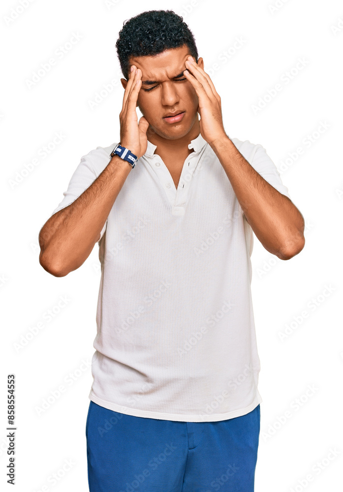 Young arab man wearing casual clothes with hand on head, headache because stress. suffering migraine. Young arab man wearing casual clothes with hand on head, headache because stress. suffering migraine.