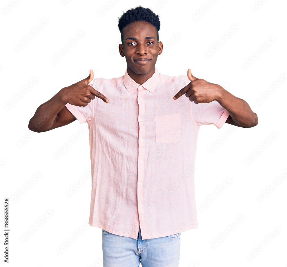 Φωτογραφία Young african american man wearing casual clothes looking confident with smile on face, pointing oneself with fingers proud and happy