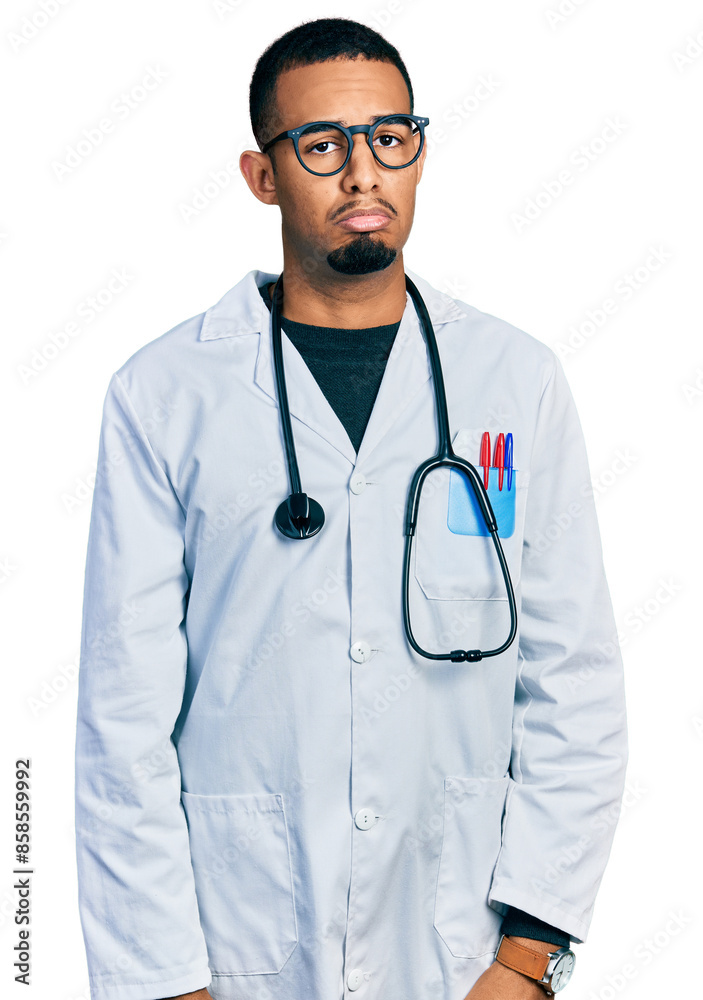 Young african american man wearing doctor uniform and stethoscope depressed and worry for distress, crying angry and afraid. sad expression. Young african american man wearing doctor uniform and stethoscope depressed and worry for distress, crying angry and afraid. sad expression.