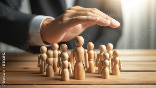 Nurturing hands safeguarding wooden figures