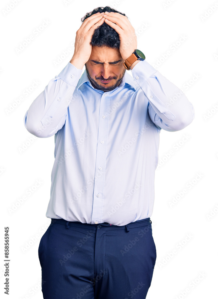 Fototapeta premium Young hispanic man wearing business clothes suffering from headache desperate and stressed because pain and migraine. hands on head.