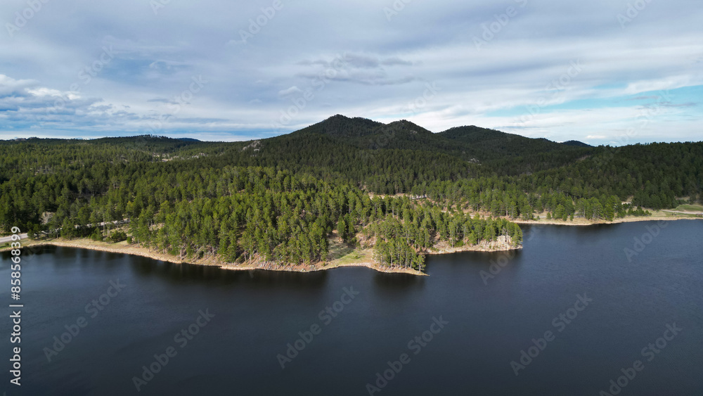 Deep blue lake, river on summer landscape. Drone shot, aerial photo of riverside and hills from above. Nature horizon with forest Deep blue lake, river on summer landscape. Drone shot, aerial photo of riverside and hills from above. Nature horizon with forest