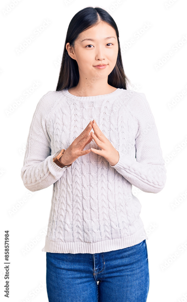 Φωτογραφία Young beautiful chinese woman wearing casual sweater hands together and fingers crossed smiling relaxed and cheerful