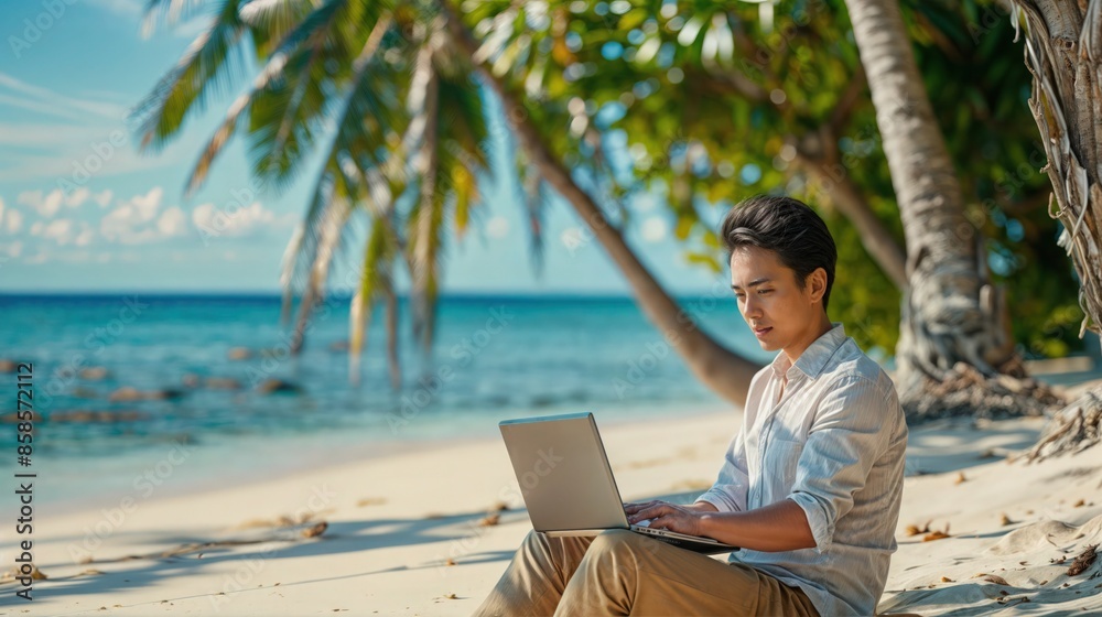 Young Professional Working on Laptop at Tropical Beach