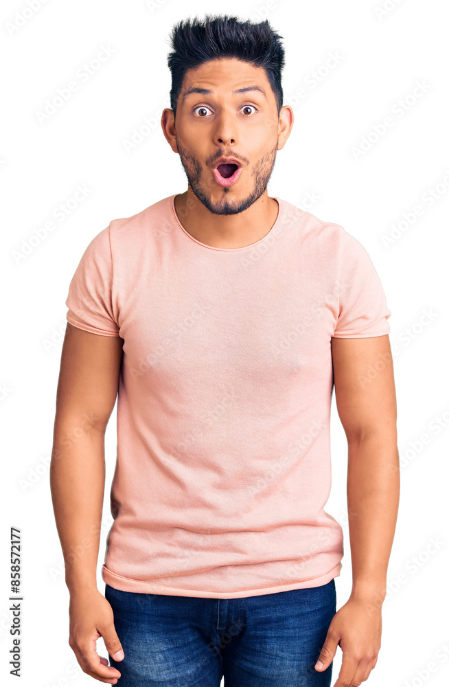 Handsome latin american young man wearing casual clothes scared and amazed with open mouth for surprise, disbelief face Handsome latin american young man wearing casual clothes scared and amazed with open mouth for surprise, disbelief face