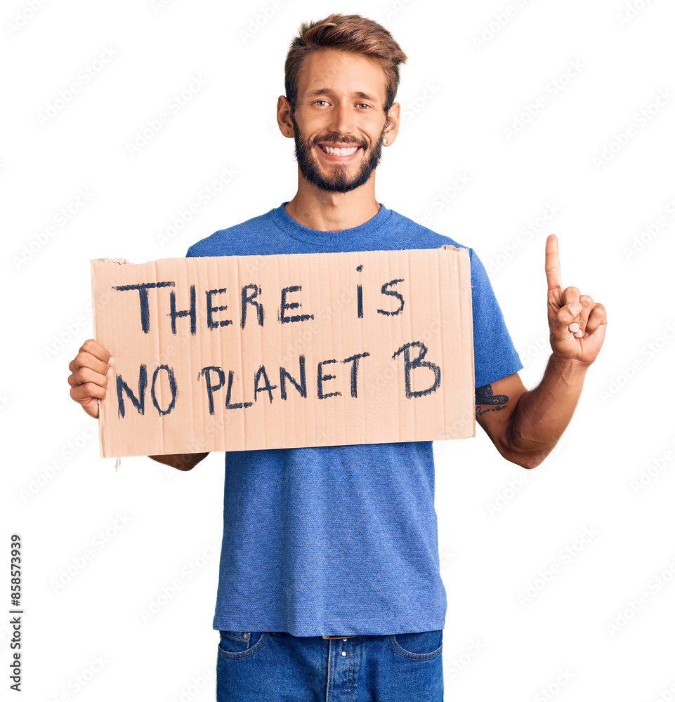 Handsome blond man with beard holding there is no planet b banner surprised with an idea or question pointing finger with happy face, number one Handsome blond man with beard holding there is no planet b banner surprised with an idea or question pointing finger with happy face, number one