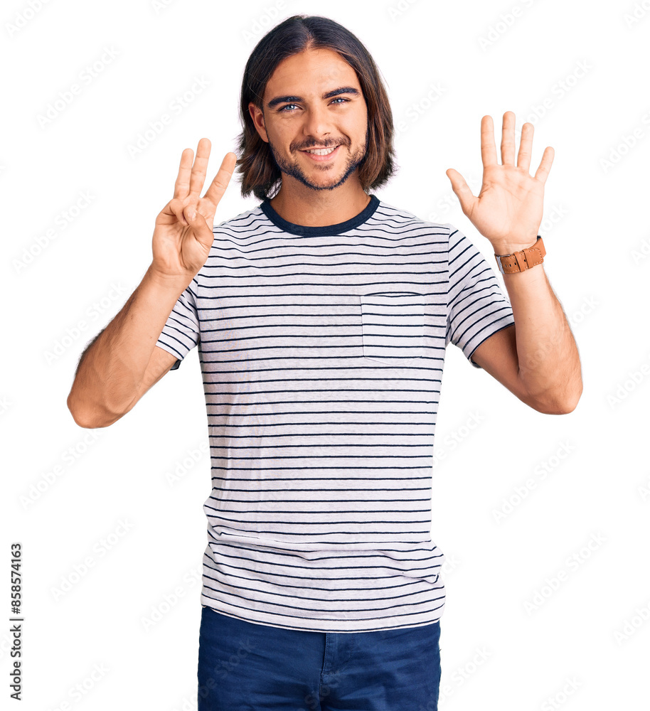 Young handsome man wearing casual clothes showing and pointing up with fingers number eight while smiling confident and happy. Young handsome man wearing casual clothes showing and pointing up with fingers number eight while smiling confident and happy.