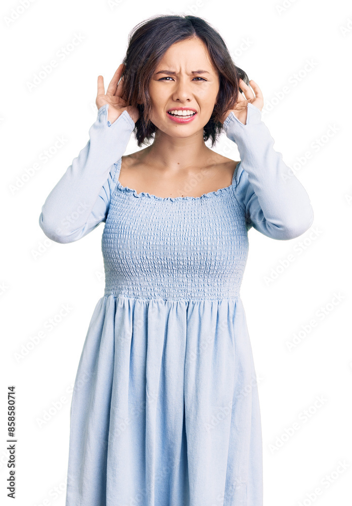 Young beautiful girl wearing casual clothes trying to hear both hands on ear gesture, curious for gossip. hearing problem, deaf Young beautiful girl wearing casual clothes trying to hear both hands on ear gesture, curious for gossip. hearing problem, deaf