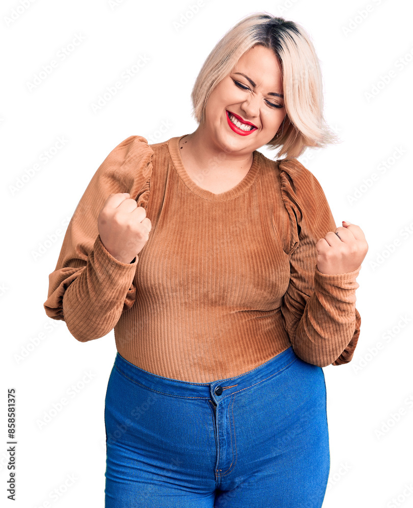 Φωτογραφία Young blonde plus size woman wearing casual sweater very happy and excited doing winner gesture with arms raised, smiling and screaming for success