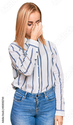 Beautiful caucasian woman wearing casual clothes tired rubbing nose and eyes feeling fatigue and headache. stress and frustration concept.