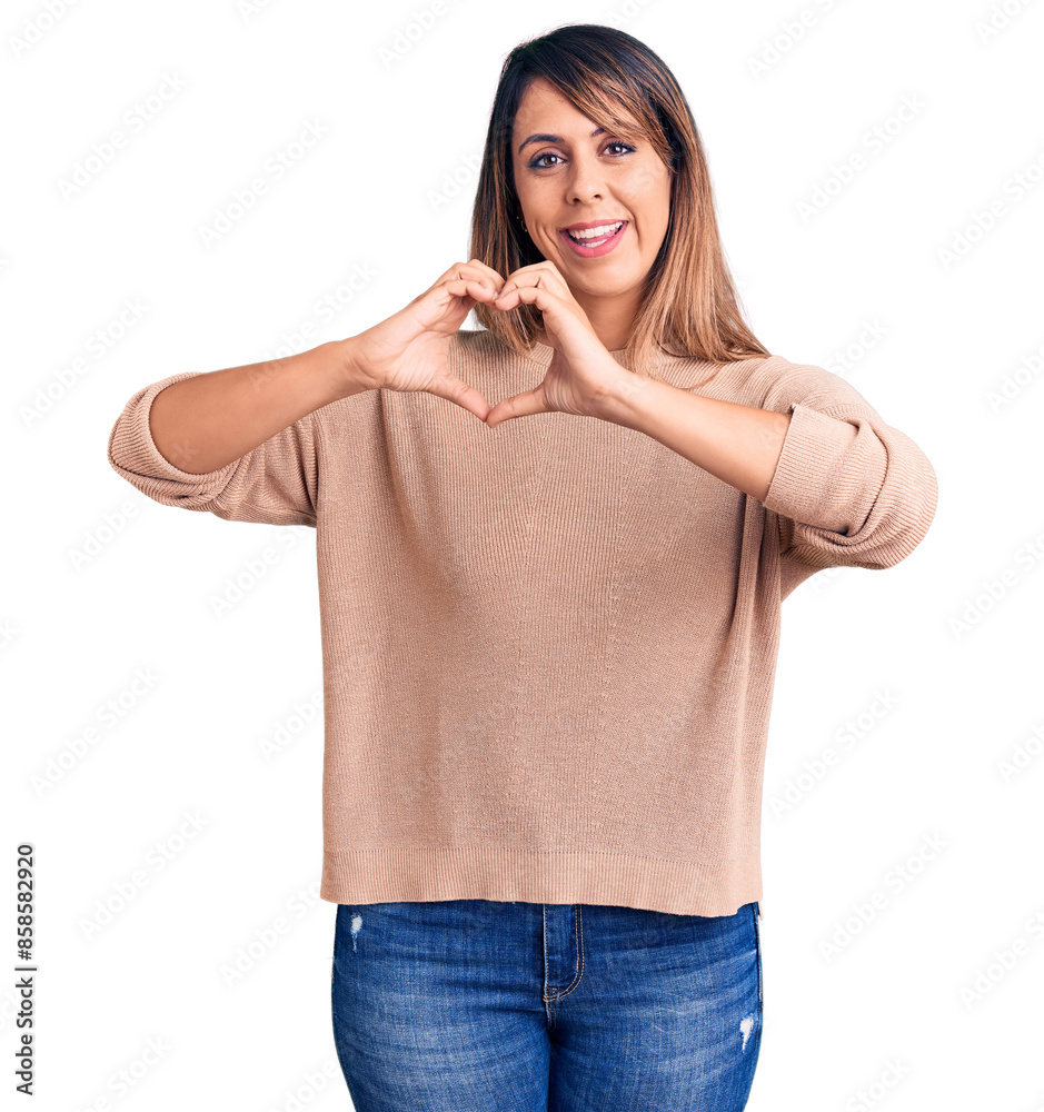 Φωτογραφία Young beautiful woman wearing casual sweater smiling in love showing heart symbol and shape with hands