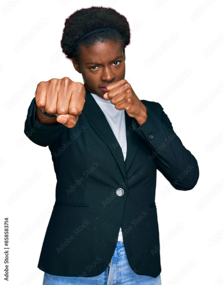 Φωτογραφία Young african american girl wearing business clothes punching fist to fight, agg