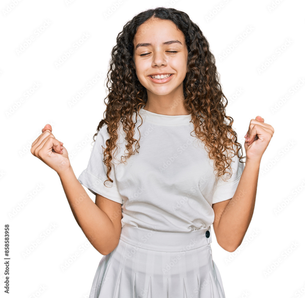 Φωτογραφία Teenager hispanic girl wearing casual white t shirt very happy and excited doing winner gesture with arms raised, smiling and screaming for success