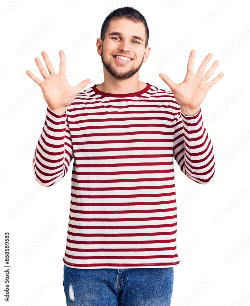 Young handsome man wearing striped sweater showing and pointing up with fingers number ten while smiling confident and happy. Young handsome man wearing striped sweater showing and pointing up with fingers number ten while smiling confident and happy.