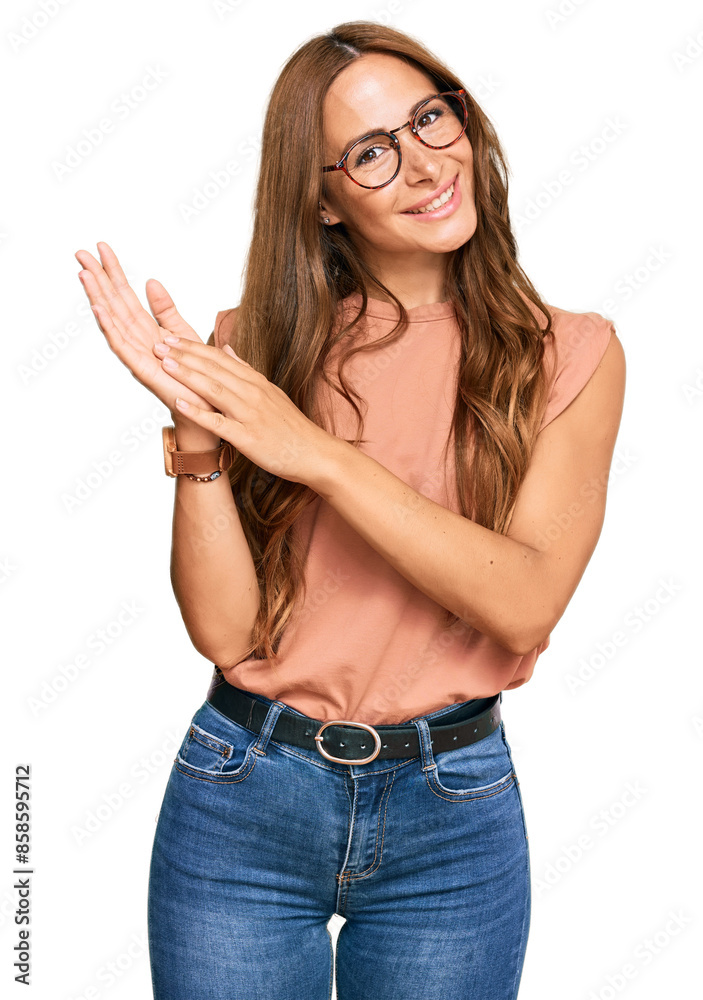 Young hispanic woman wearing casual clothes and glasses clapping and applauding happy and joyful, smiling proud hands together Young hispanic woman wearing casual clothes and glasses clapping and applauding happy and joyful, smiling proud hands together