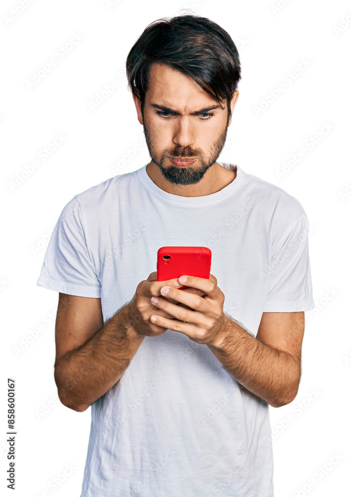Hispanic man with blue eyes using smartphone typing message puffing cheeks with funny face. mouth inflated with air, catching air. Hispanic man with blue eyes using smartphone typing message puffing cheeks with funny face. mouth inflated with air, catching air.