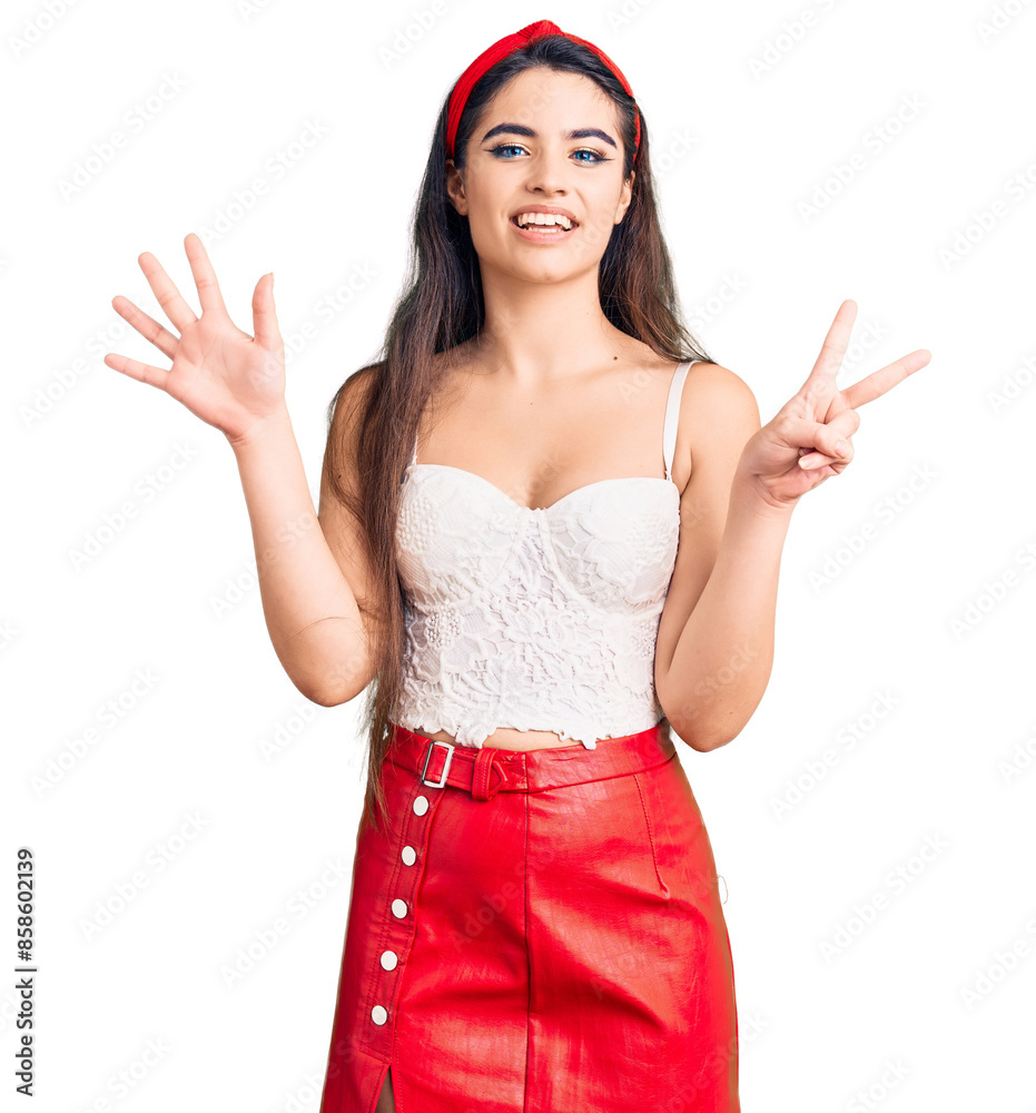 Brunette teenager girl wearing elegant look showing and pointing up with fingers number seven while smiling confident and happy. Brunette teenager girl wearing elegant look showing and pointing up with fingers number seven while smiling confident and happy.