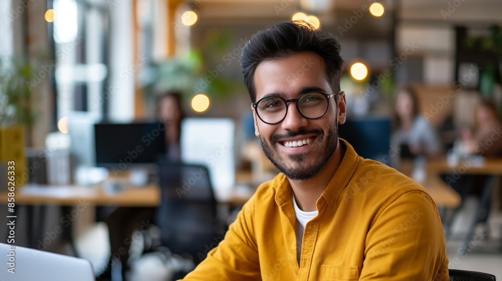 Fototapeta premium portrait of Social Media Manager working in modern office, smiling man in office 