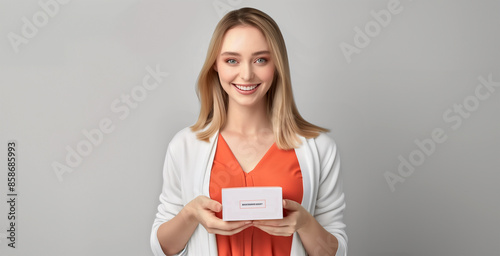 Bright Smile: Woman Presenting a Product Box