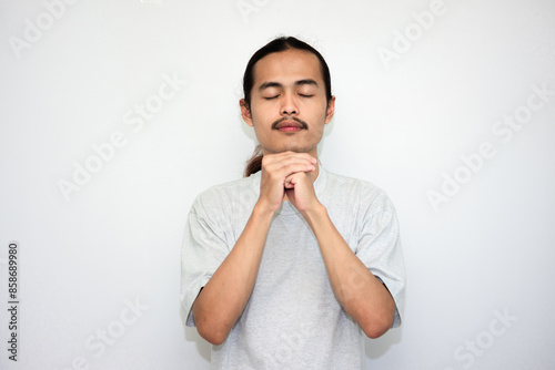 Praying, man and hands in meditation or worship of God because of faith or belief in spirituality. isolated in white background