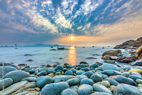 Fototapeta Naklejka Na Ścianę i Meble -  Beautiful sunrise on egg stone beach near Quy Nhon city, Vietnam