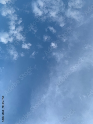Image of blue sky with a few clouds © AuntieCW