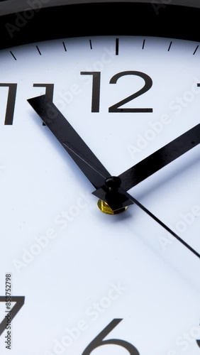 Sun and sky reflecting in the watch during the time passing by. Time lapse on a modern white Clock on black. Close up to a wall clock, with running time pointer. Wall clock show the running time. 