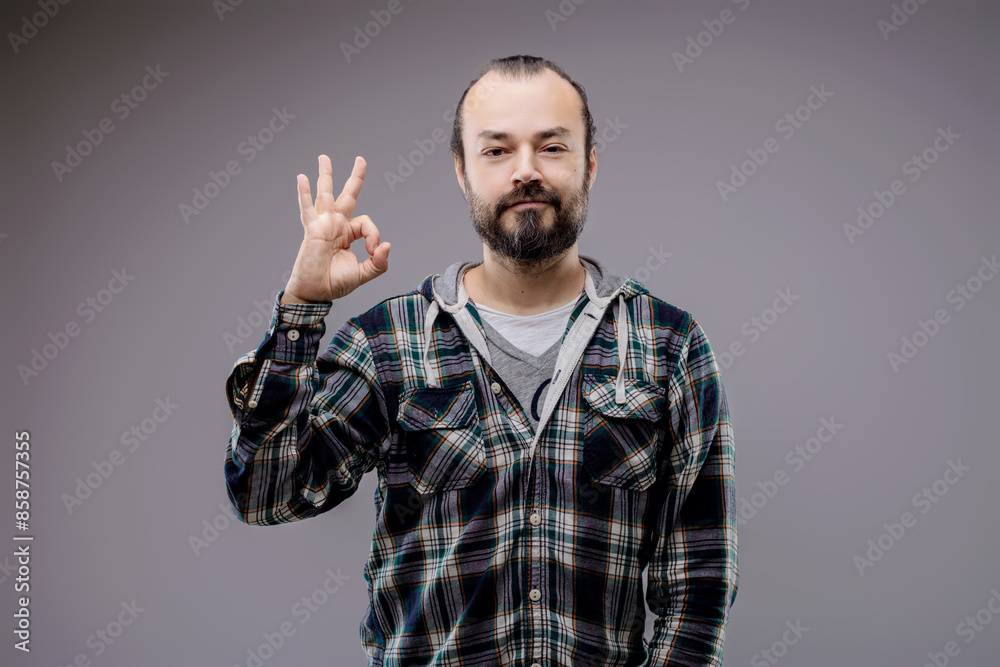 Fototapeta premium Confident man making ok sign gesture approving