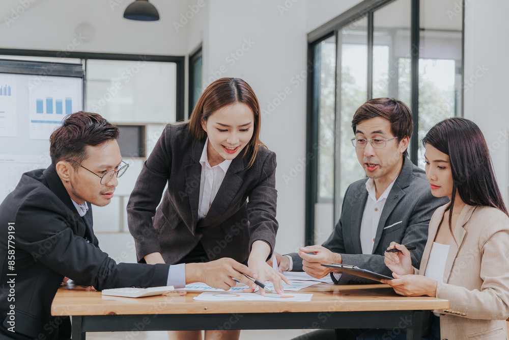 Professional team, including businessmen and businesswomen, engages in a strategy meeting. They discuss marketing, analyze financial data, and brainstorm investment plans using charts, graphs, Professional team, including businessmen and businesswomen, engages in a strategy meeting. They discuss marketing, analyze financial data, and brainstorm investment plans using charts, graphs,