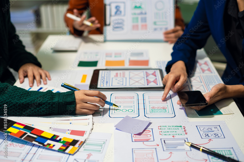 UX developer and ui designer brainstorming about mobile app interface wireframe design with customer breif and color code, User experience concept.. UX developer and ui designer brainstorming about mobile app interface wireframe design with customer breif and color code, User experience concept..