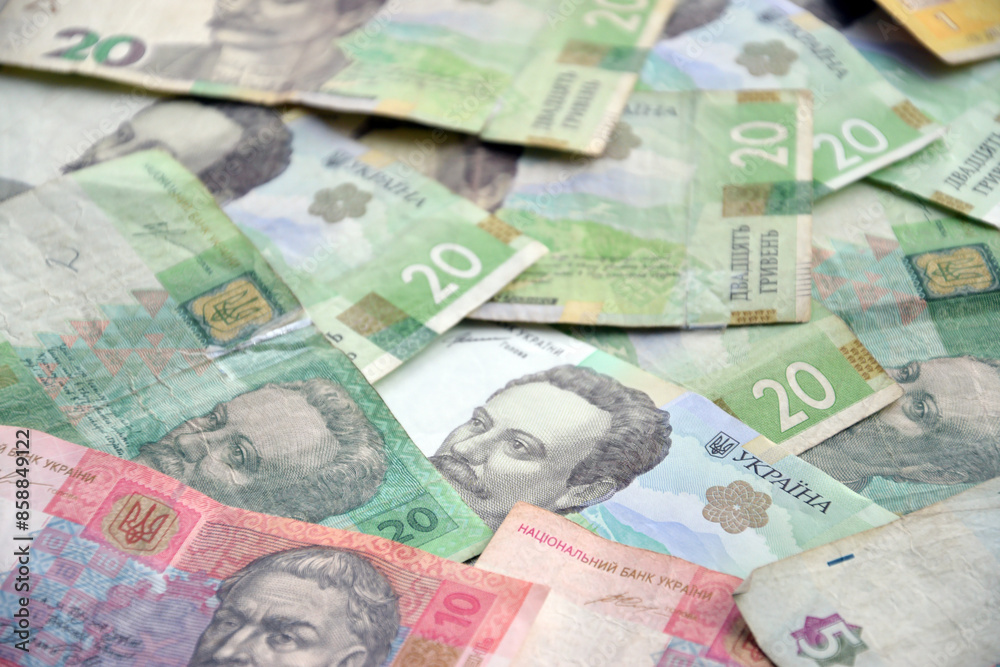 Processed collage of Ukrainian Hryvnia UAH bills banknotes texture. Background for banner Processed collage of Ukrainian Hryvnia UAH bills banknotes texture. Background for banner