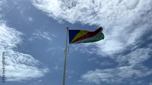Seychelles Flag flying with sky behind